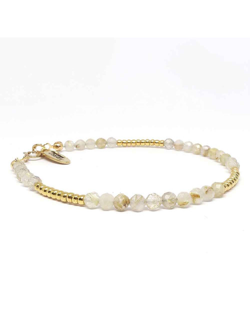 Le quartz rutilé est un cristal de roche ou un quartz qui contient des faisceaux de rutile